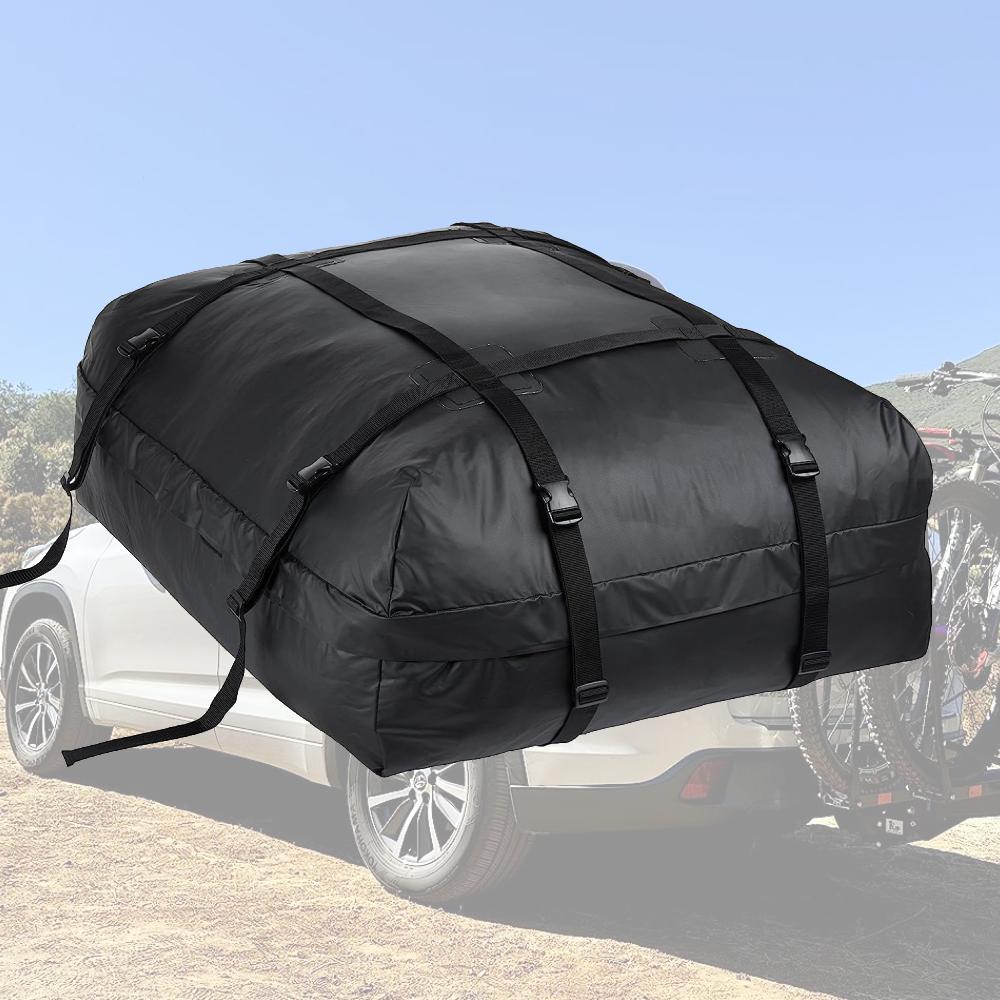 A roof top cargo carrier bag strapped to a car roof